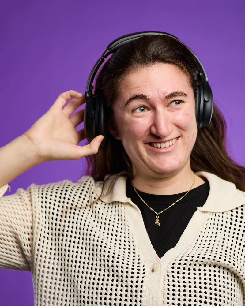 Portrait of Rose Kitz wearing over-ear headphones